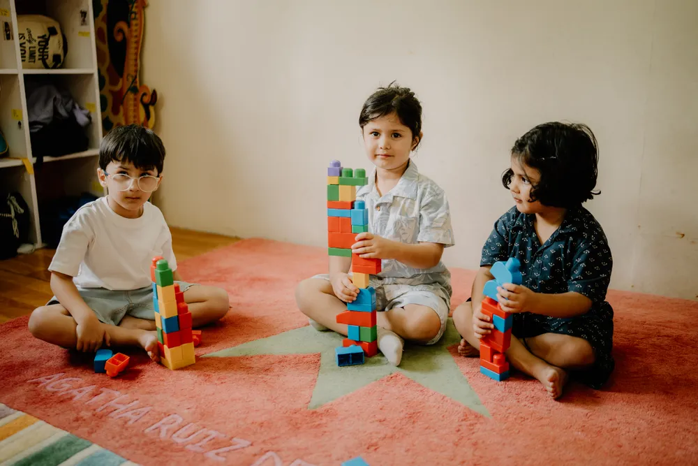 Children building with blocks during a learning activity