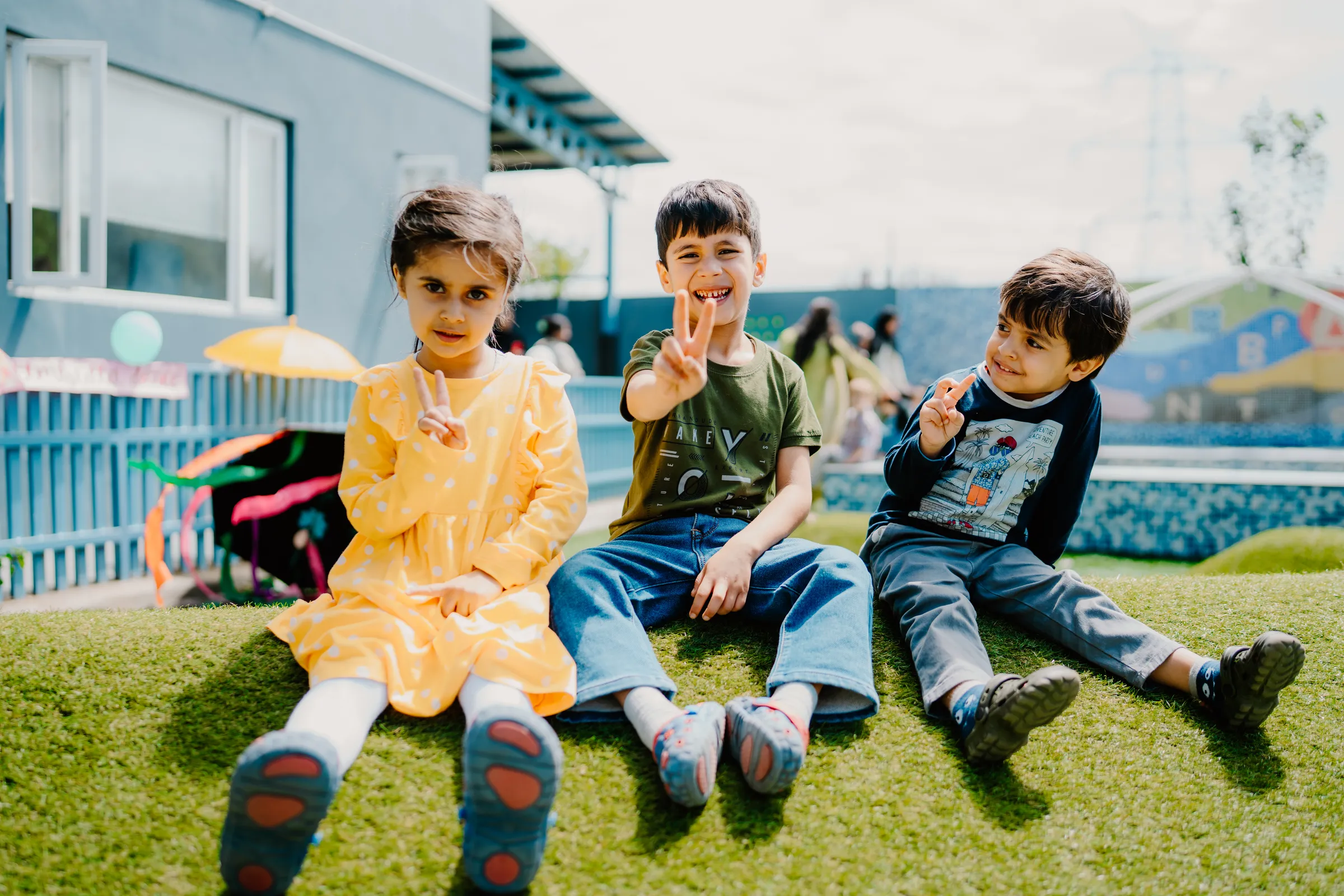 Happy children playing outdoors on a sunny day at Toddler World